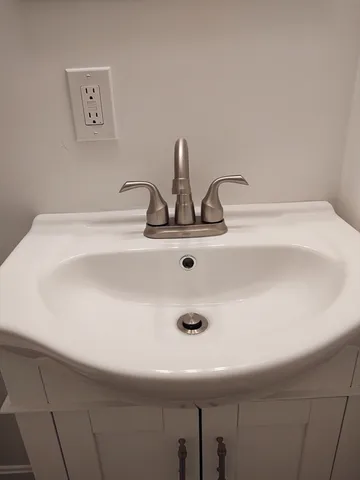 a bathroom with a shower and a shower