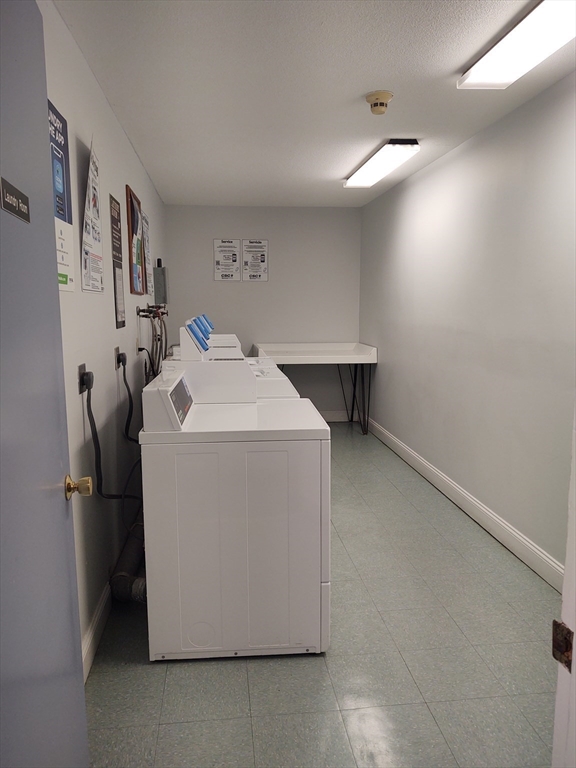 3 Leonard Road, Unit 3 Boxborough, MA 01719 - Photo 23 of 31 a utility room with dryer and washer