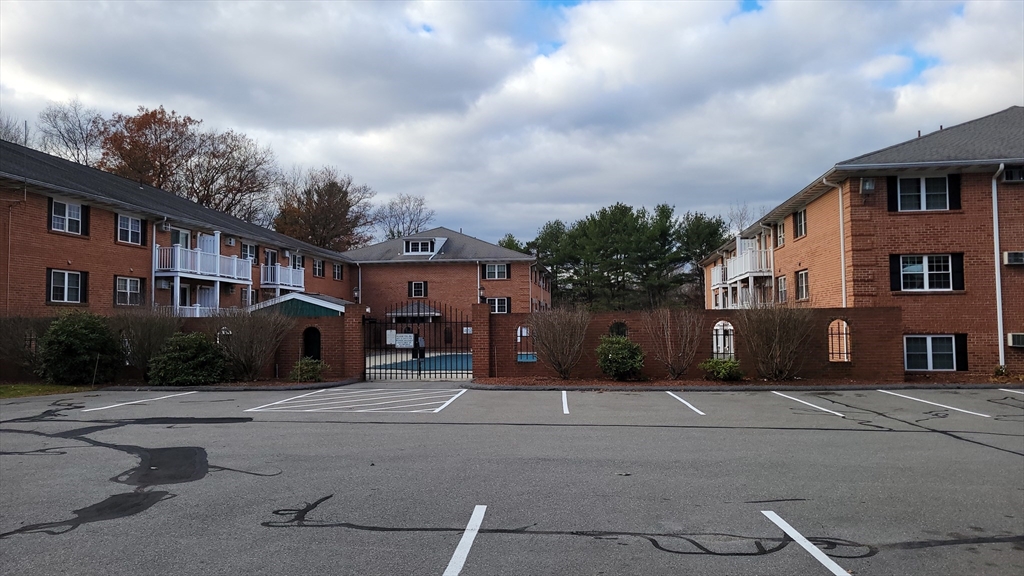 3 Leonard Road, Unit 3 Boxborough, MA 01719 - Photo 30 of 31 a front view of a house with a yard