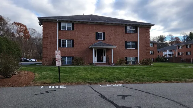 a brick house with a yard