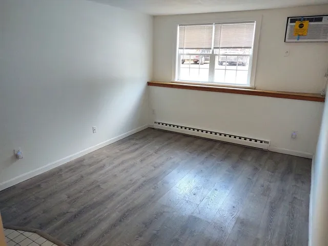 a view of a kitchen with wooden floor