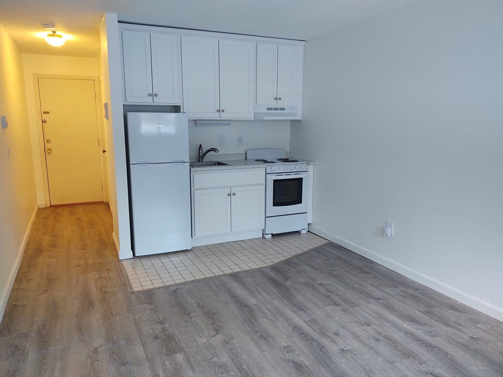 3 Leonard Road, Unit 3 Boxborough, MA 01719 - Photo 9 of 31 a view of a kitchen with wooden floor