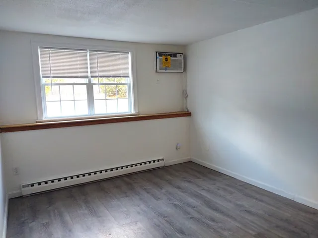 a kitchen with a white cabinets and white appliances