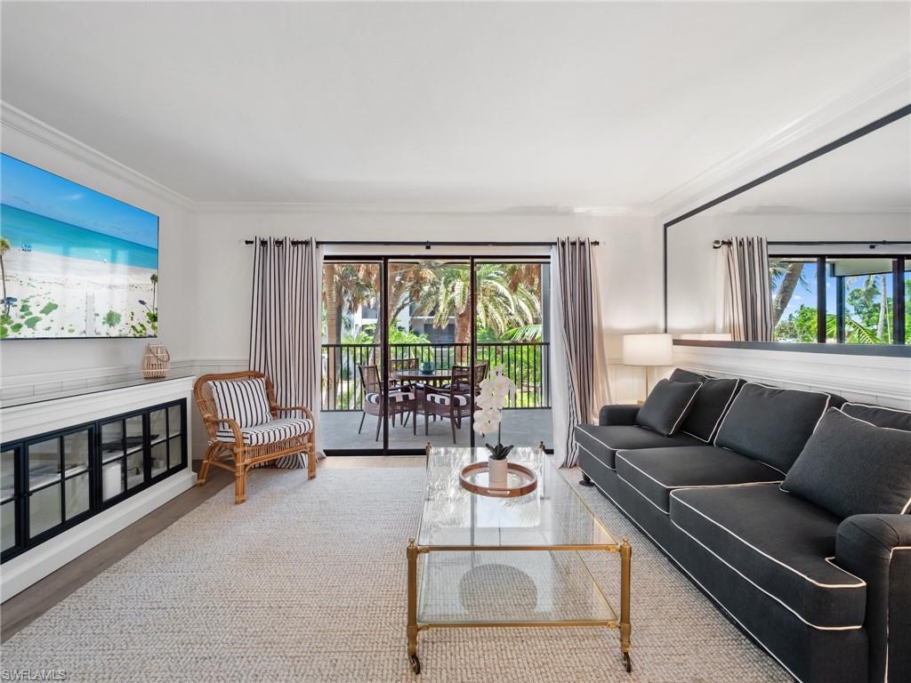 3113 Tennis Villas Captiva, FL 33924 - Photo 15 of 48 a living room with furniture and a large window