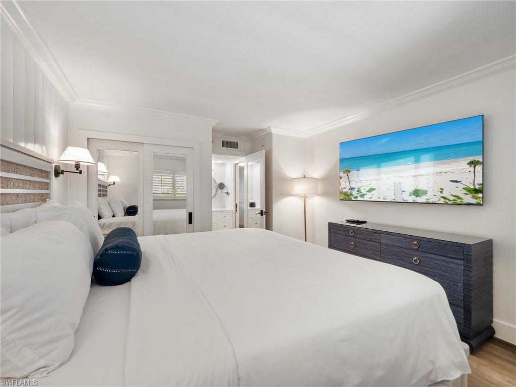 3113 Tennis Villas Captiva, FL 33924 - Photo 27 of 48 a bedroom with a bed and a couch