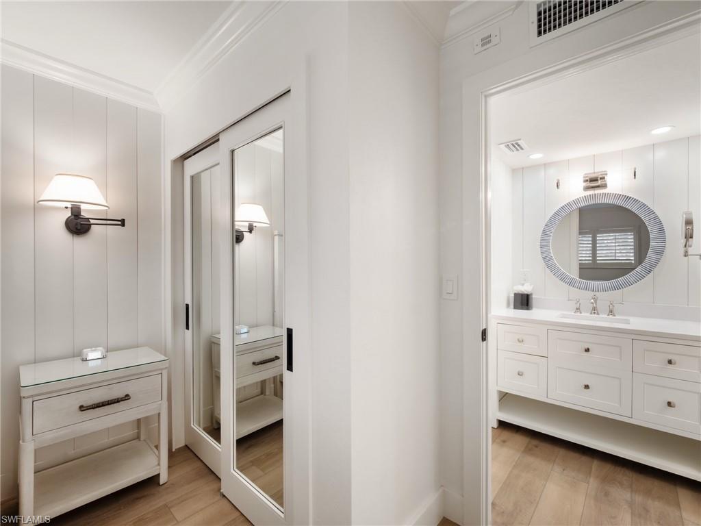 3113 Tennis Villas Captiva, FL 33924 - Photo 32 of 48 a bathroom with a double vanity sink and mirror