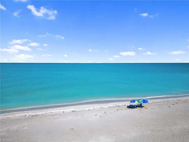 a view of a room with an empty space and a window