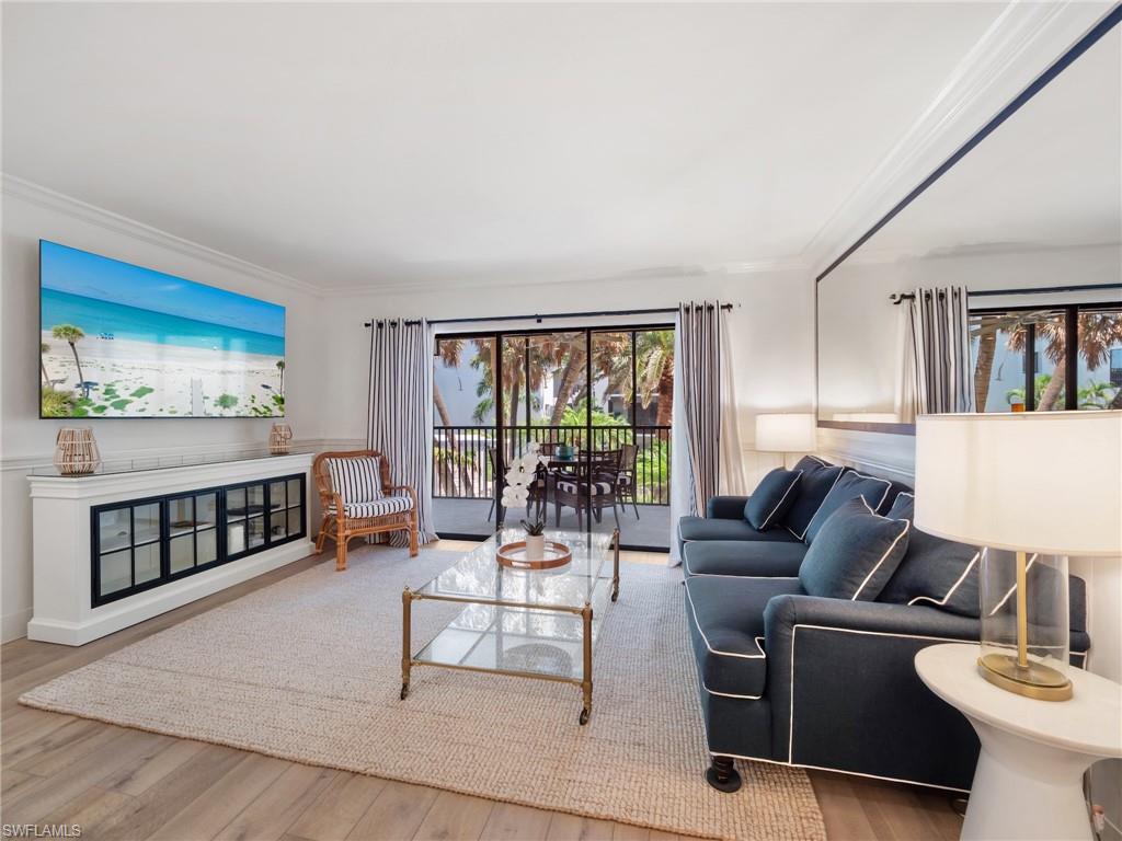 3113 Tennis Villas Captiva, FL 33924 - Photo 8 of 48 a living room with furniture and a window