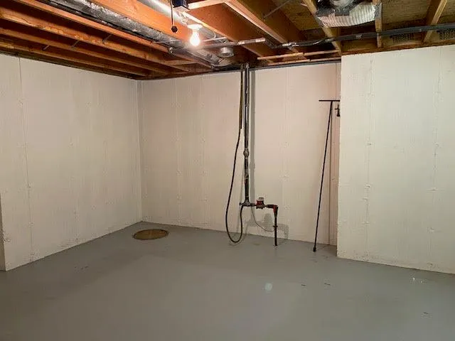 a view of an empty room with a large window