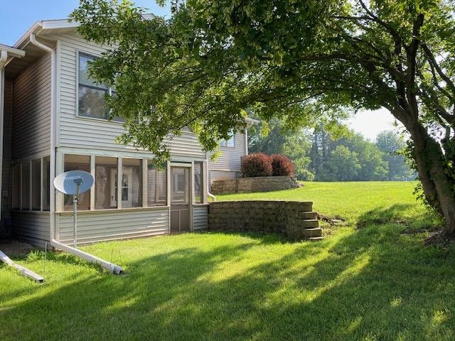 1911 Mustang Court Freeport, IL 61032 - Photo 13 of 14 a view of a house with backyard and sitting area