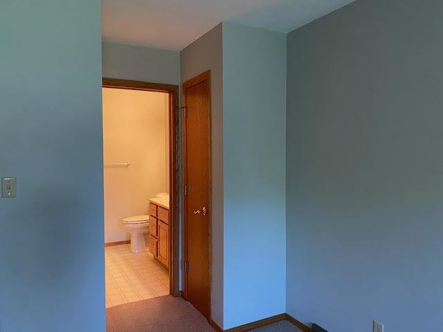 1911 Mustang Court Freeport, IL 61032 - Photo 10 of 14 a bathroom with a toilet and a sink