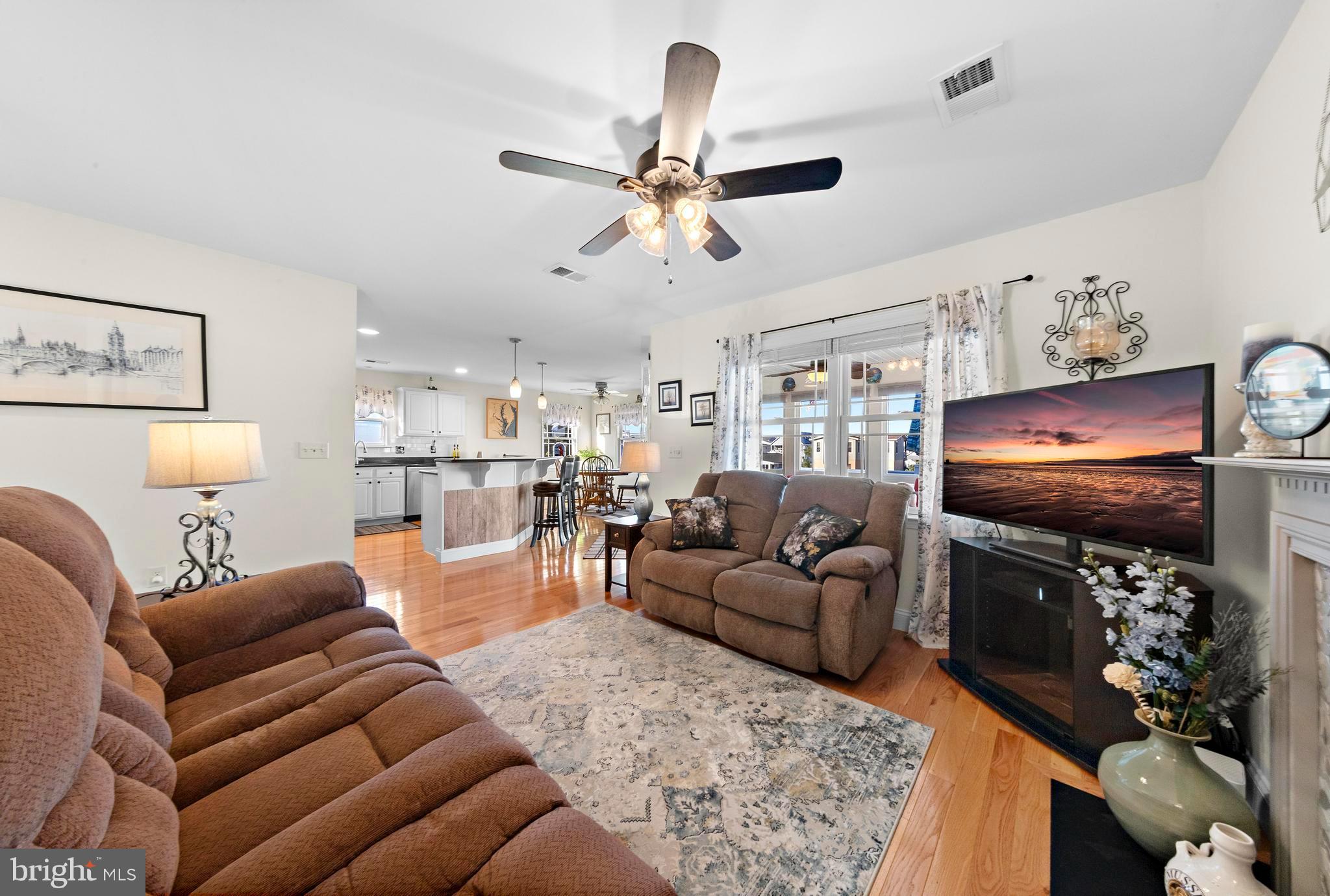 32 West Navasink Drive Little Egg Harbor, NJ 08087 - Photo 13 of 71 a living room with furniture a ceiling fan and a rug