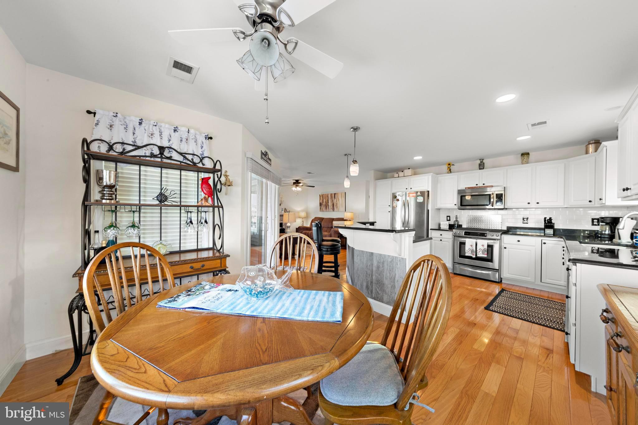 32 West Navasink Drive Little Egg Harbor, NJ 08087 - Photo 20 of 71 a dining room with furniture a rug and wooden floor