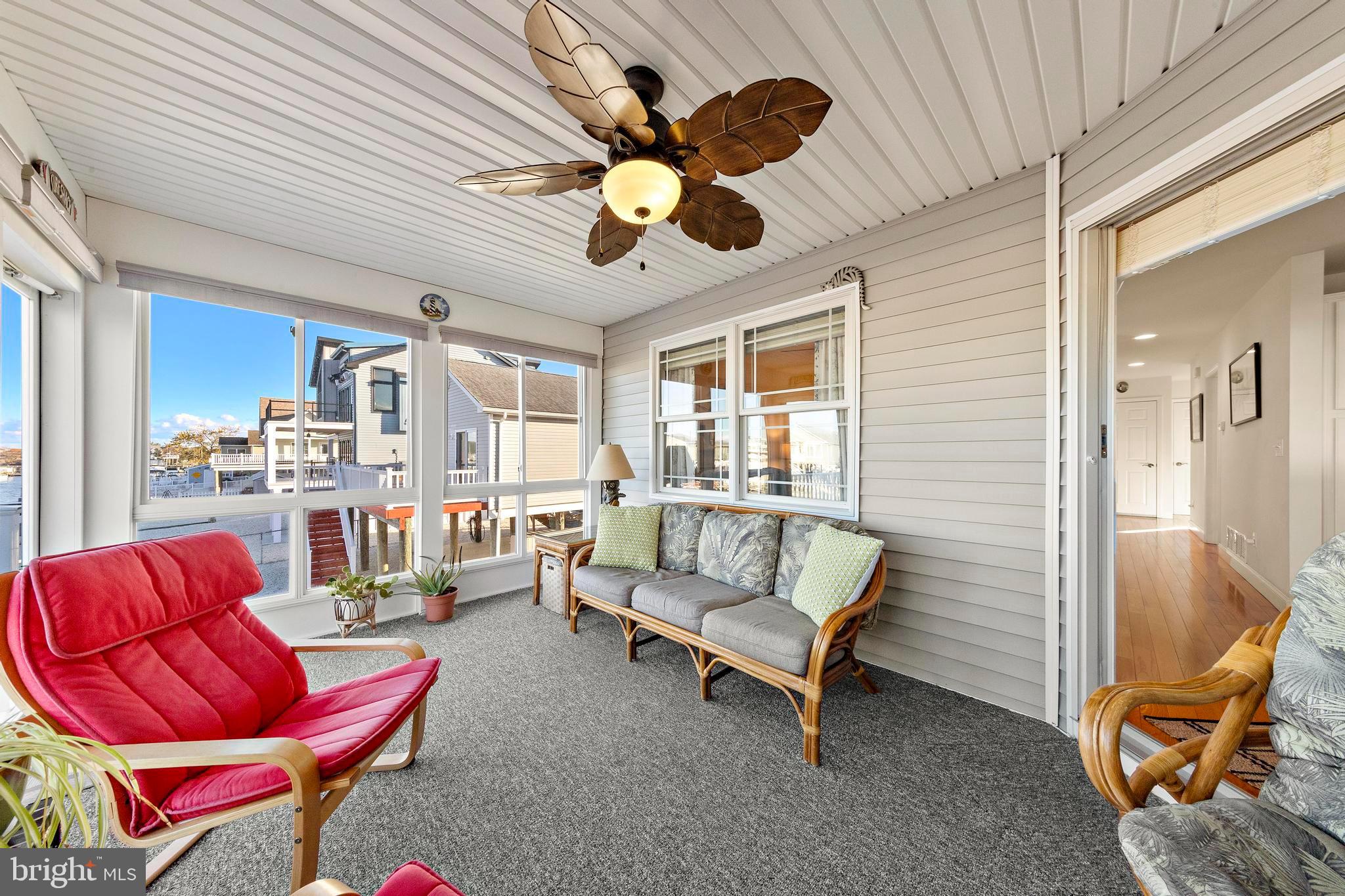 32 West Navasink Drive Little Egg Harbor, NJ 08087 - Photo 24 of 71 a living room with furniture a ceiling fan and a window
