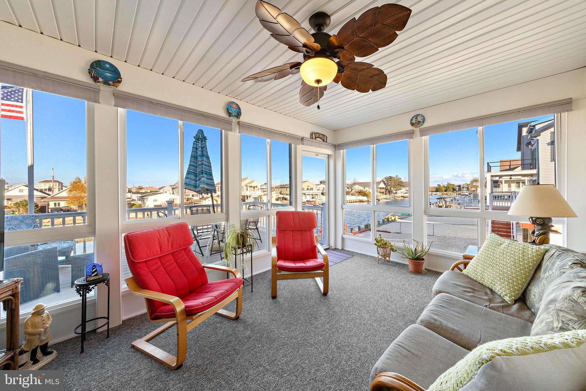 32 West Navasink Drive Little Egg Harbor, NJ 08087 - Photo 25 of 71 a living room with furniture kitchen view and a chandelier