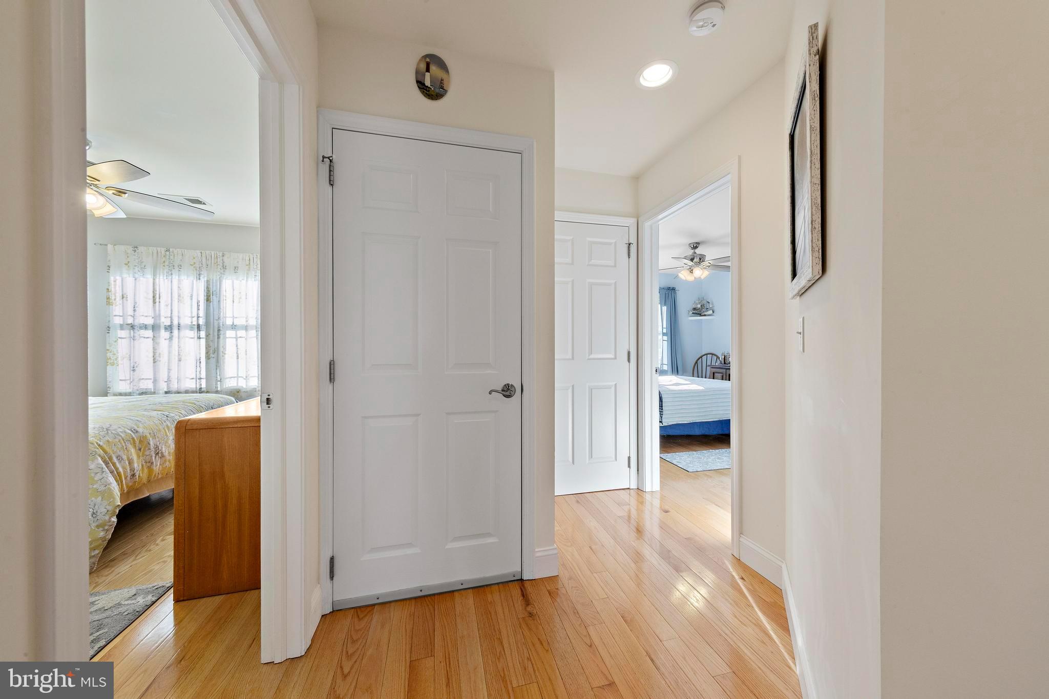 32 West Navasink Drive Little Egg Harbor, NJ 08087 - Photo 33 of 71 a view of a hallway with wooden floor and a bathroom