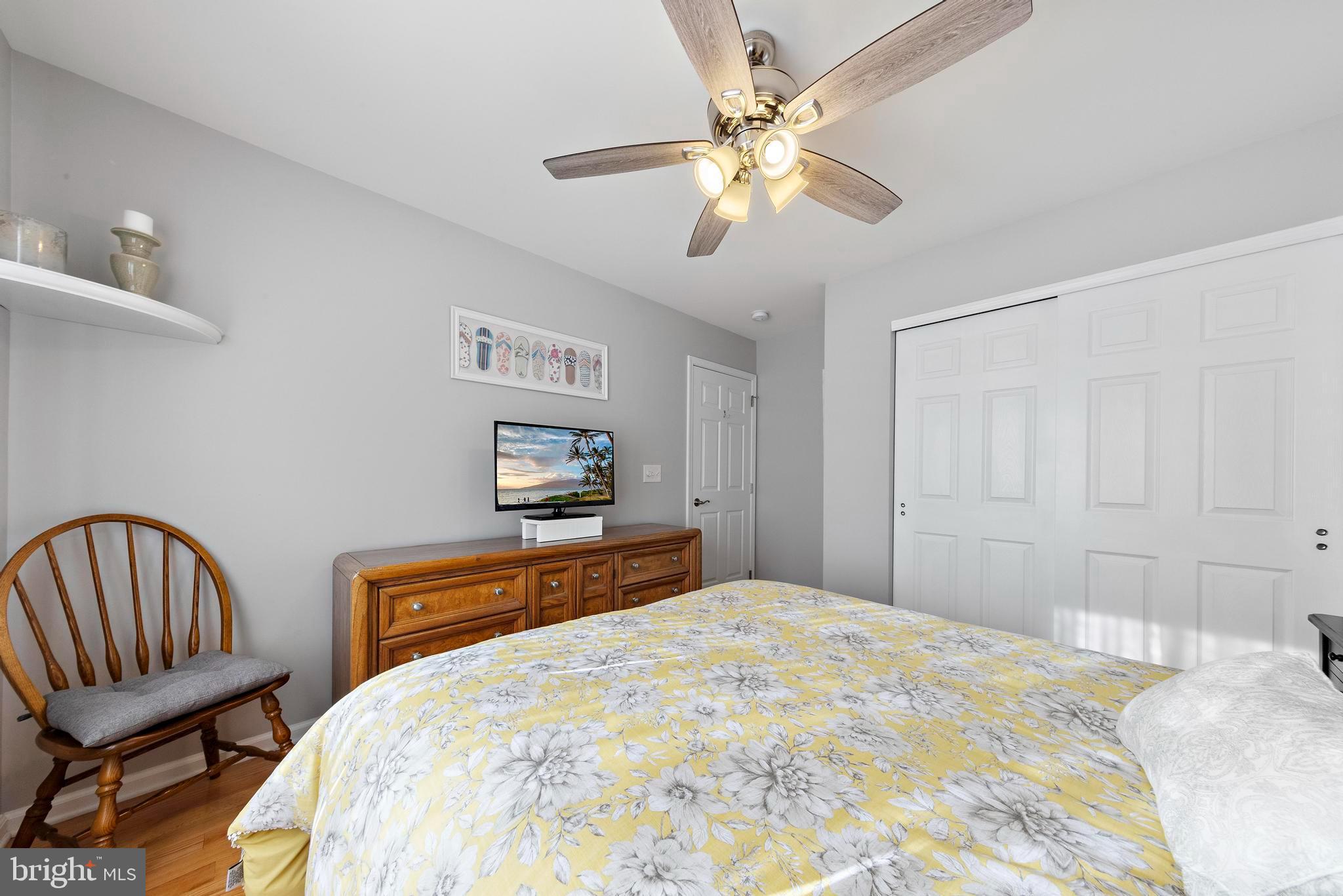 32 West Navasink Drive Little Egg Harbor, NJ 08087 - Photo 40 of 71 a bedroom with a bed and a chandelier