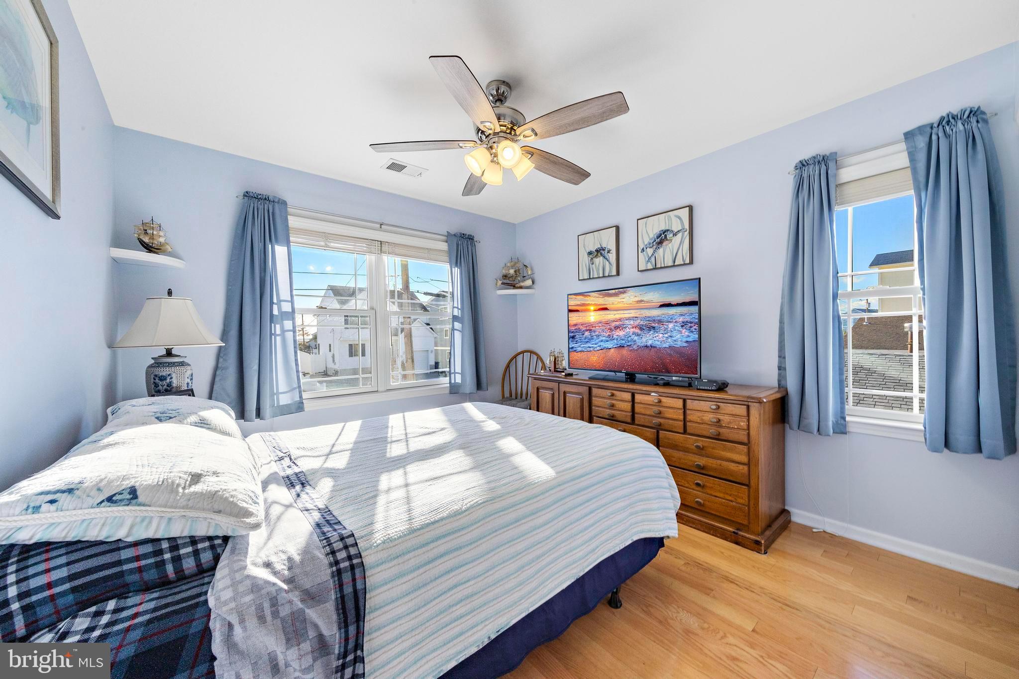 32 West Navasink Drive Little Egg Harbor, NJ 08087 - Photo 41 of 71 a bedroom with a bed and a flat screen tv