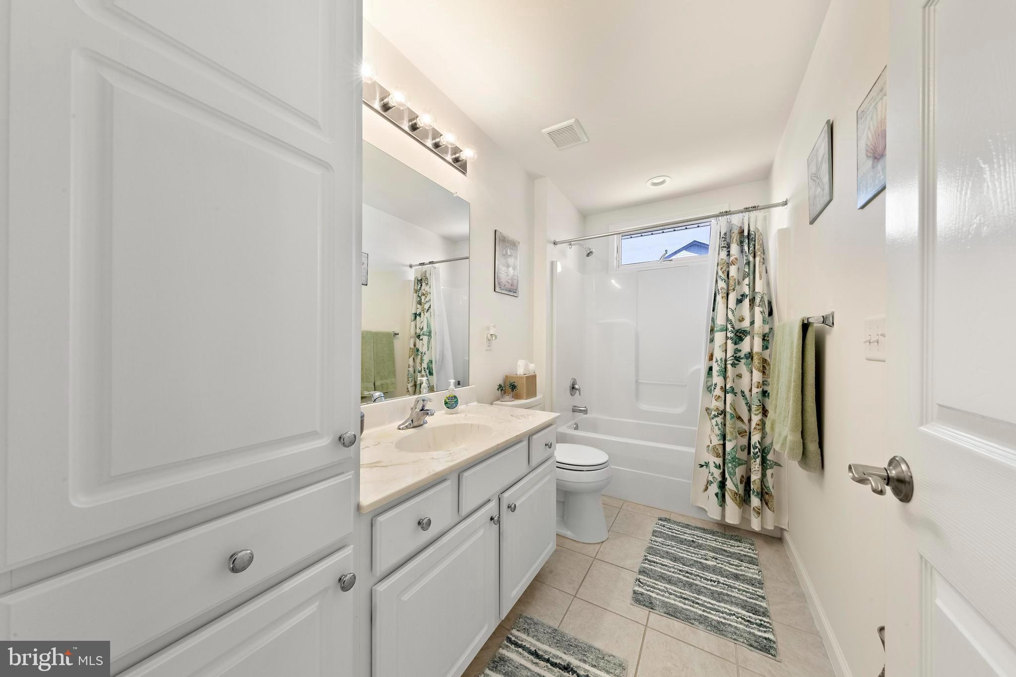 32 West Navasink Drive Little Egg Harbor, NJ 08087 - Photo 43 of 71 a spacious bathroom with a double vanity sink a toilet and a shower