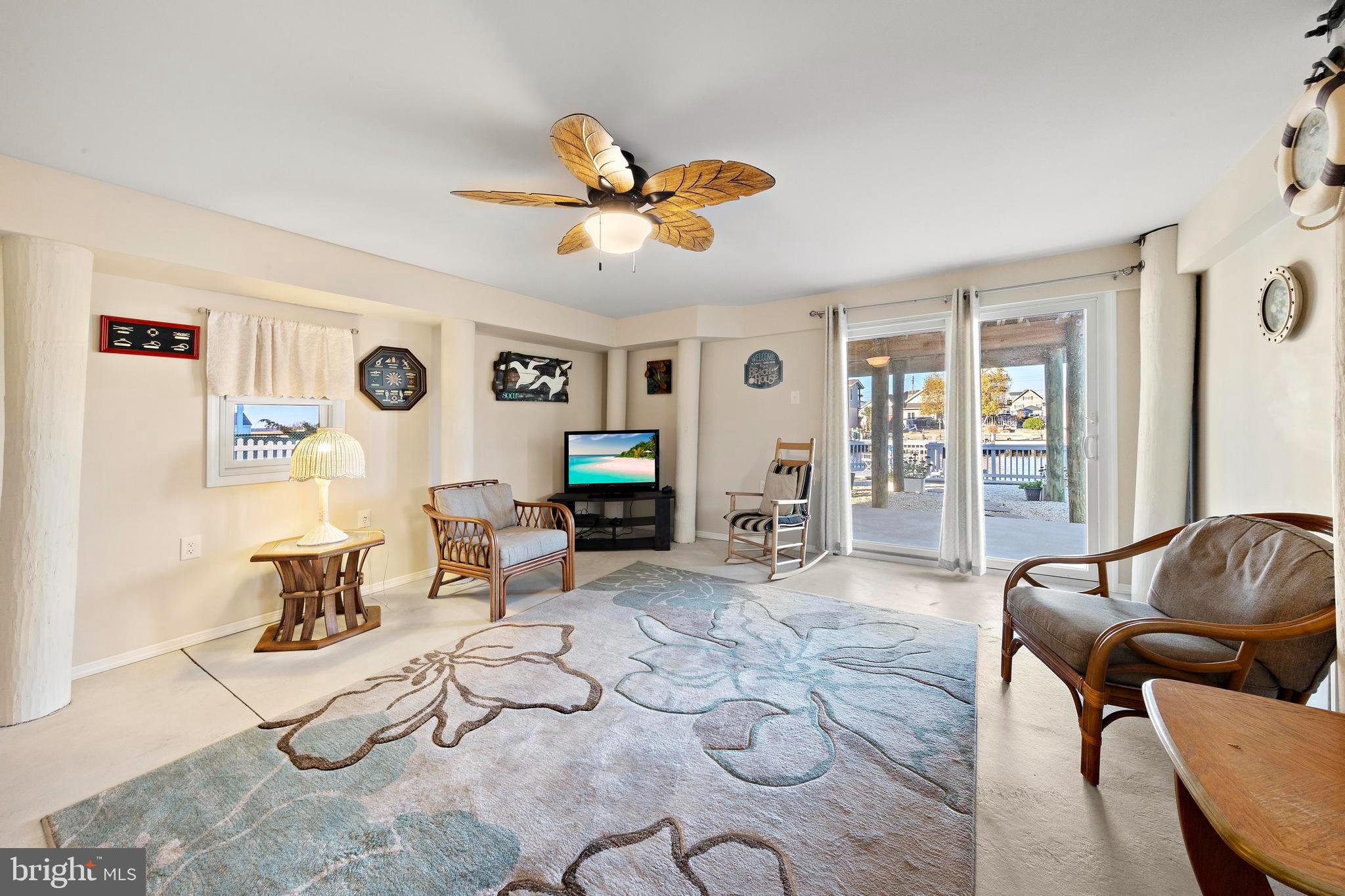 32 West Navasink Drive Little Egg Harbor, NJ 08087 - Photo 46 of 71 a living room with furniture and a flat screen tv