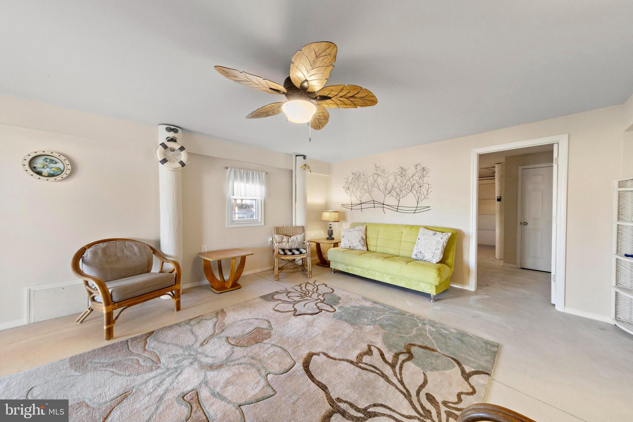 32 West Navasink Drive Little Egg Harbor, NJ 08087 - Photo 49 of 71 a bedroom with a bed and a chandelier