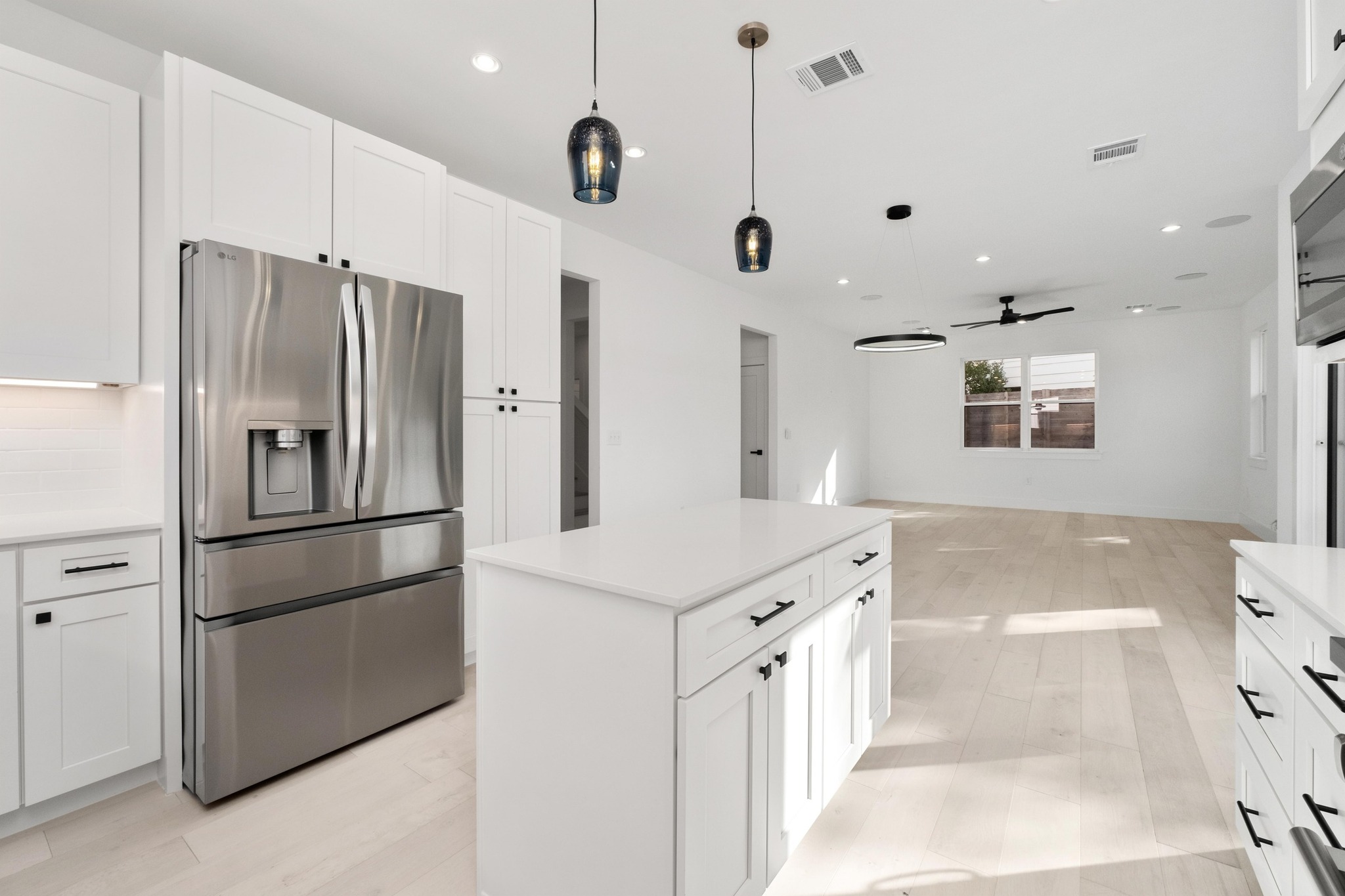 1500 Sylvan Glade, Unit 2A Austin, TX 78745 - Photo 11 of 29 a kitchen with a refrigerator a sink and cabinets