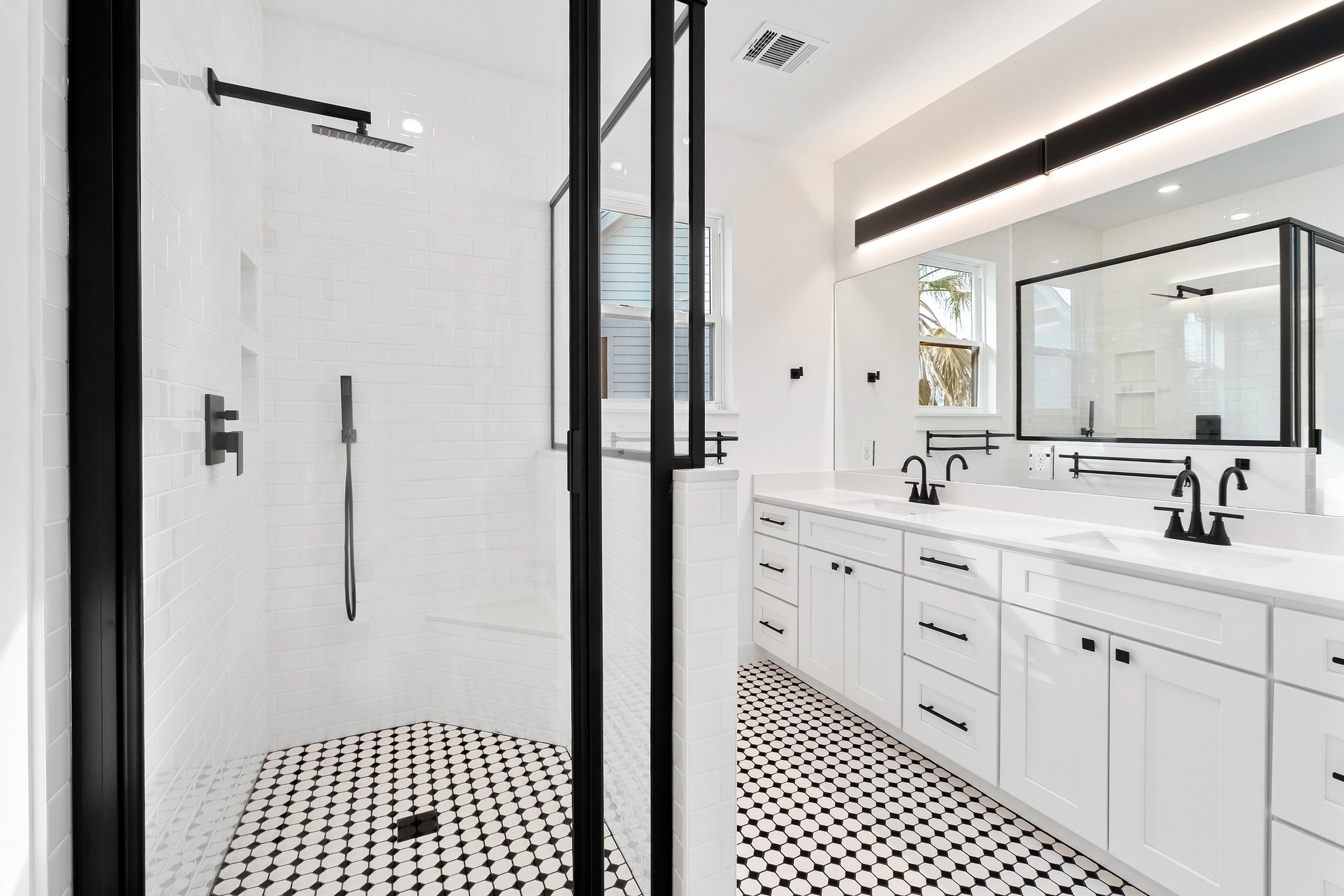 1500 Sylvan Glade, Unit 2A Austin, TX 78745 - Photo 16 of 29 a bathroom with a double vanity sink a mirror and shower