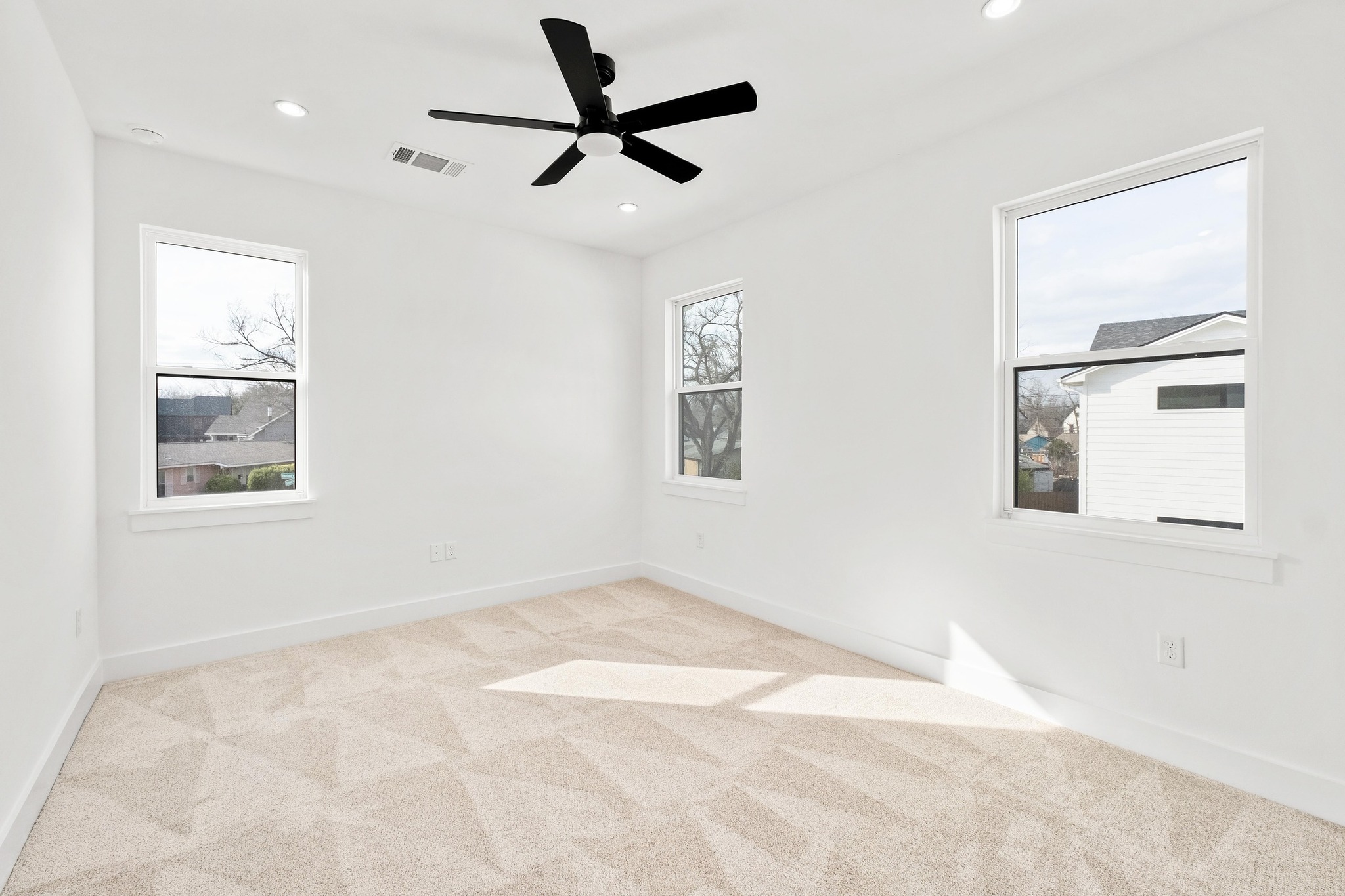 1500 Sylvan Glade, Unit 2A Austin, TX 78745 - Photo 20 of 29 a view of empty room with windows and fan