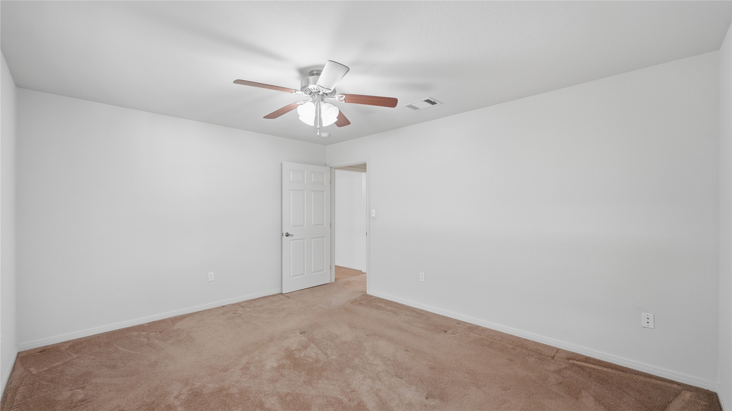 369 Young School House Road Smithville, TX 78957 - Photo 17 of 30 Unfurnished room with light carpet and a ceiling fan