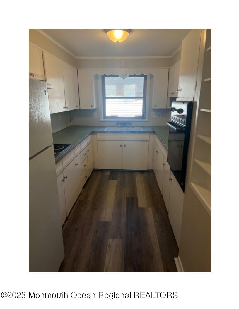 105-107 Atlantic Street Bridgeton, NJ 08302 - Photo 1 of 20 a kitchen with a sink a refrigerator and window