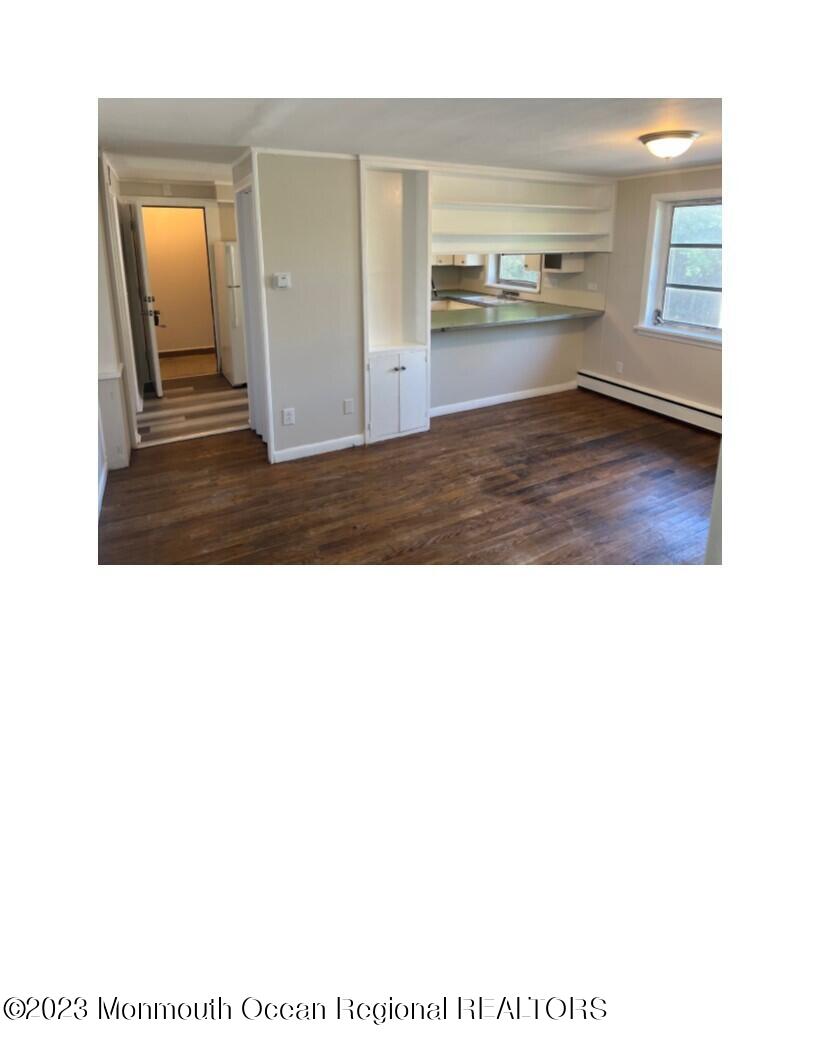 105-107 Atlantic Street Bridgeton, NJ 08302 - Photo 3 of 20 a view of a living room and kitchen