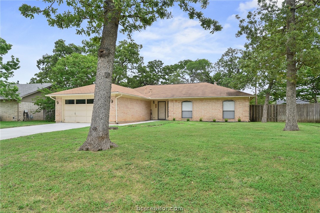 1104 Haley Place College Station, TX 77845 - Photo 1 of 1 a front view of a house with a garden