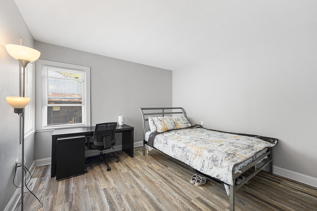 43 Belcourt Road Worcester, MA 01605 - Photo 11 of 26 a bedroom with a bed and a table