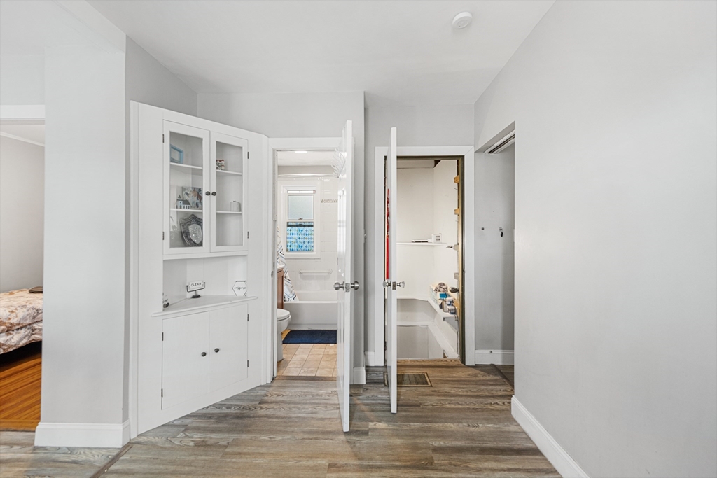 43 Belcourt Road Worcester, MA 01605 - Photo 17 of 26 wooden floor with white walls