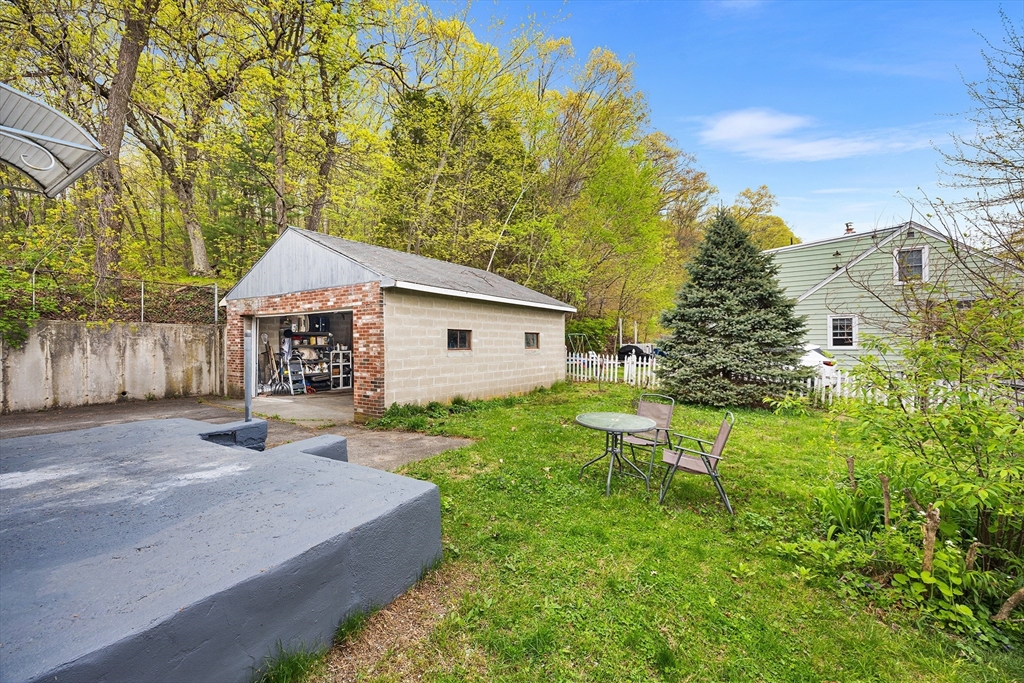 43 Belcourt Road Worcester, MA 01605 - Photo 23 of 26 a front view of a house with a yard and trees