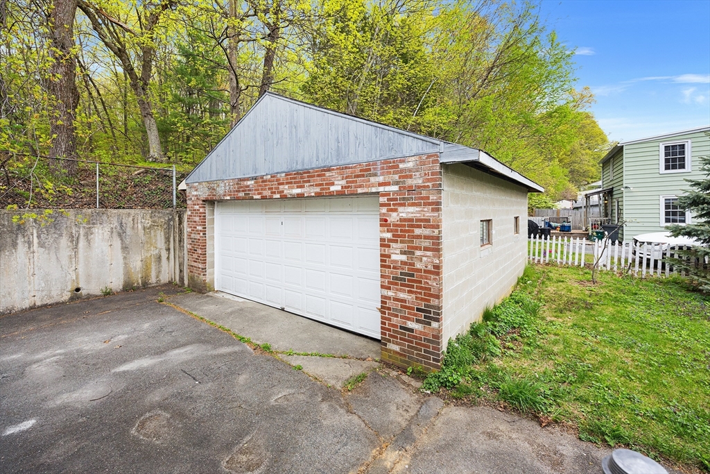 43 Belcourt Road Worcester, MA 01605 - Photo 24 of 26 a view of backyard of house with wooden fence