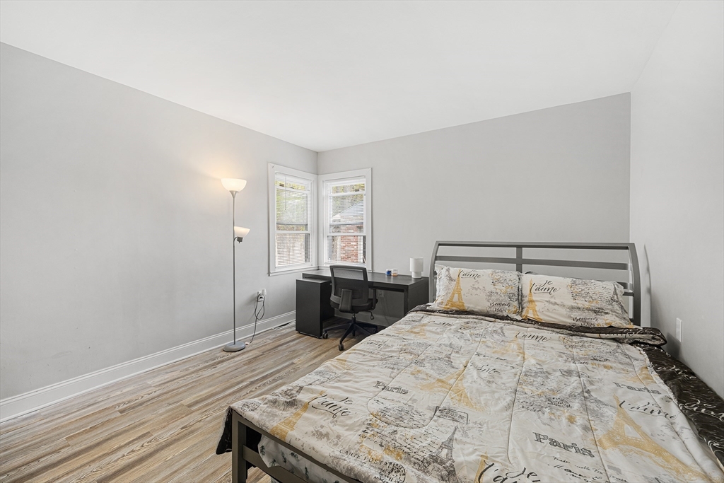 43 Belcourt Road Worcester, MA 01605 - Photo 10 of 26 a bedroom with a bed and wooden floor
