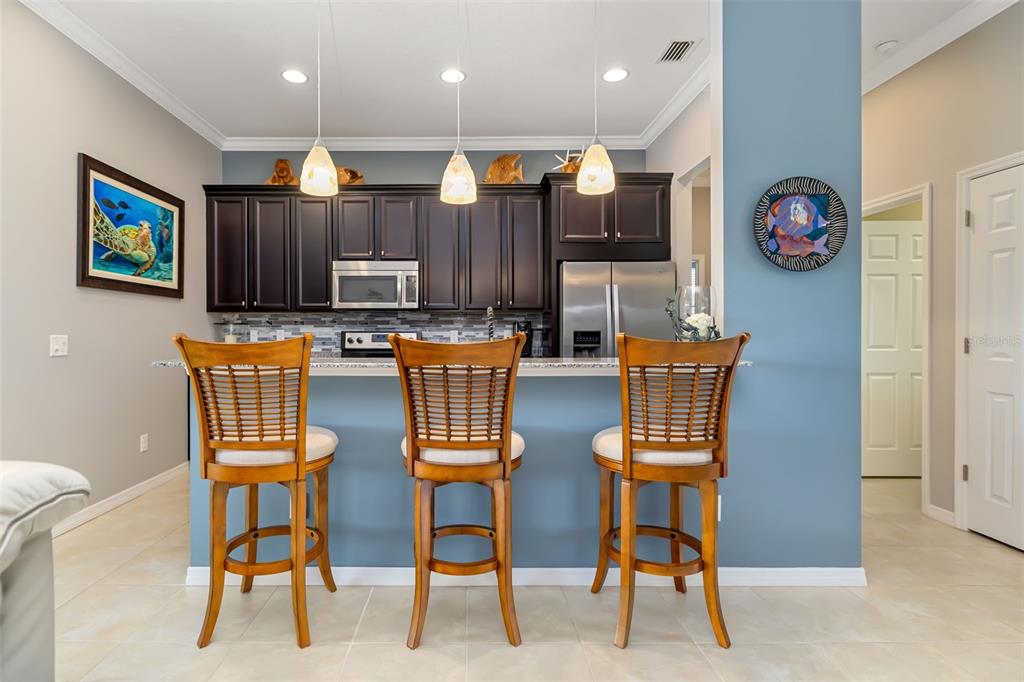 12844 24th St Circle East Parrish, FL 34219 - Photo 11 of 57 a view of a dining room with furniture