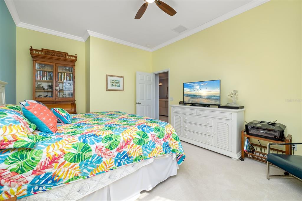 12844 24th St Circle East Parrish, FL 34219 - Photo 19 of 57 a bedroom with a bed and a tv