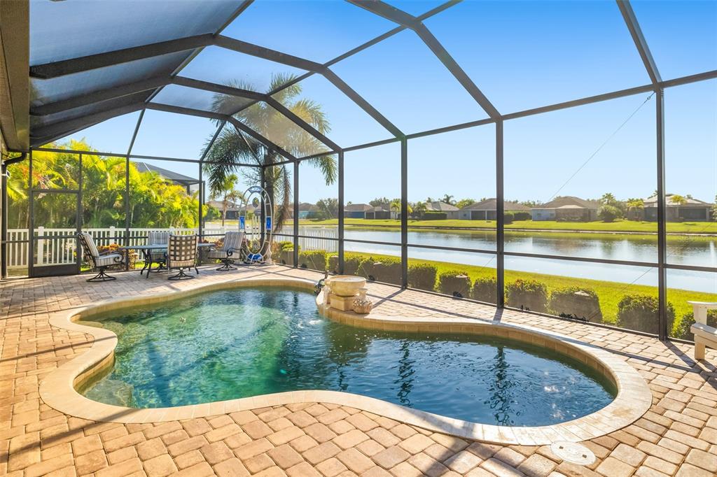 12844 24th St Circle East Parrish, FL 34219 - Photo 2 of 57 a view of a swimming pool with a porch