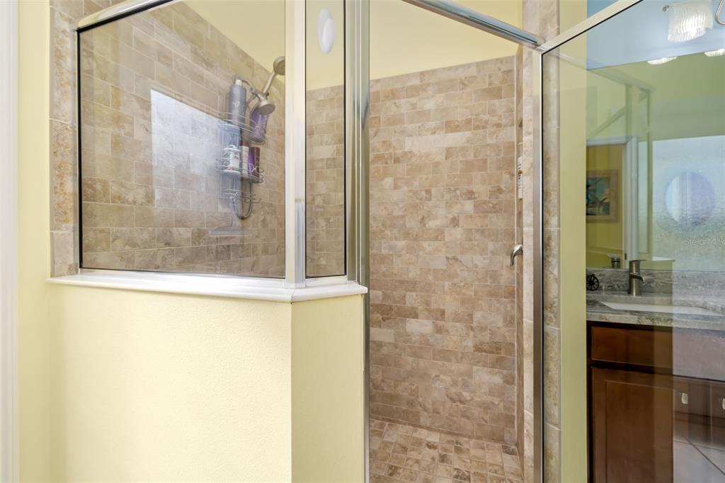 12844 24th St Circle East Parrish, FL 34219 - Photo 24 of 57 a bathroom with a shower and a sink