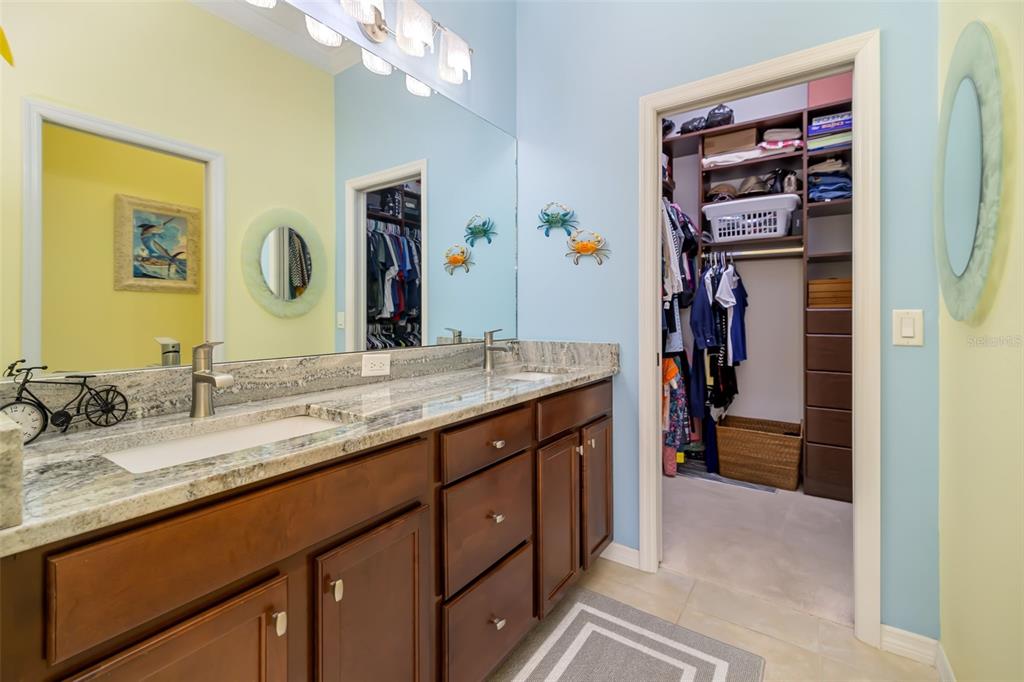 12844 24th St Circle East Parrish, FL 34219 - Photo 25 of 57 a en suite bathroom with a granite countertop sink and a mirror