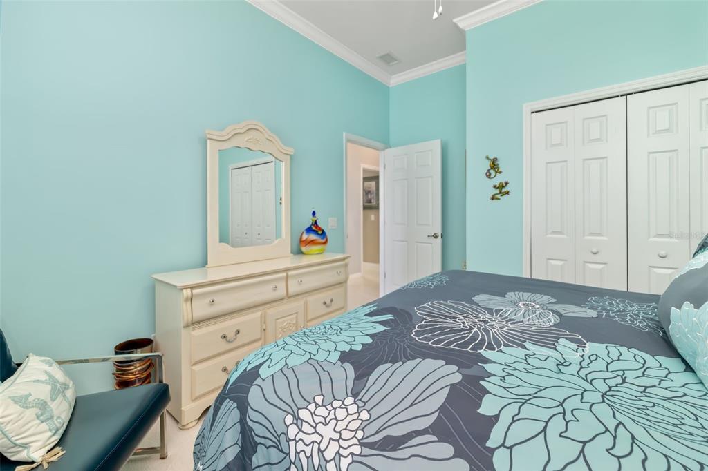 12844 24th St Circle East Parrish, FL 34219 - Photo 27 of 57 a bedroom with a bed and a dresser in it