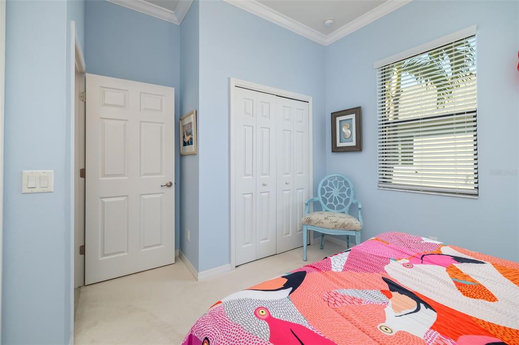 12844 24th St Circle East Parrish, FL 34219 - Photo 29 of 57 a bedroom with a bed and a window
