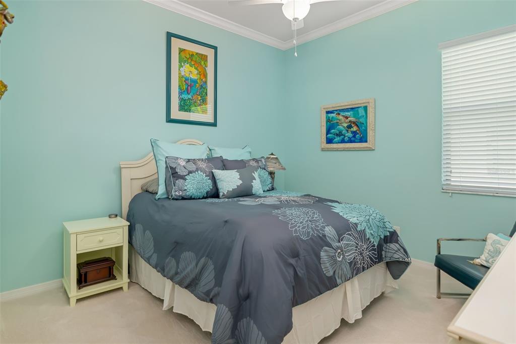 12844 24th St Circle East Parrish, FL 34219 - Photo 30 of 57 a bedroom with a bed and a tv