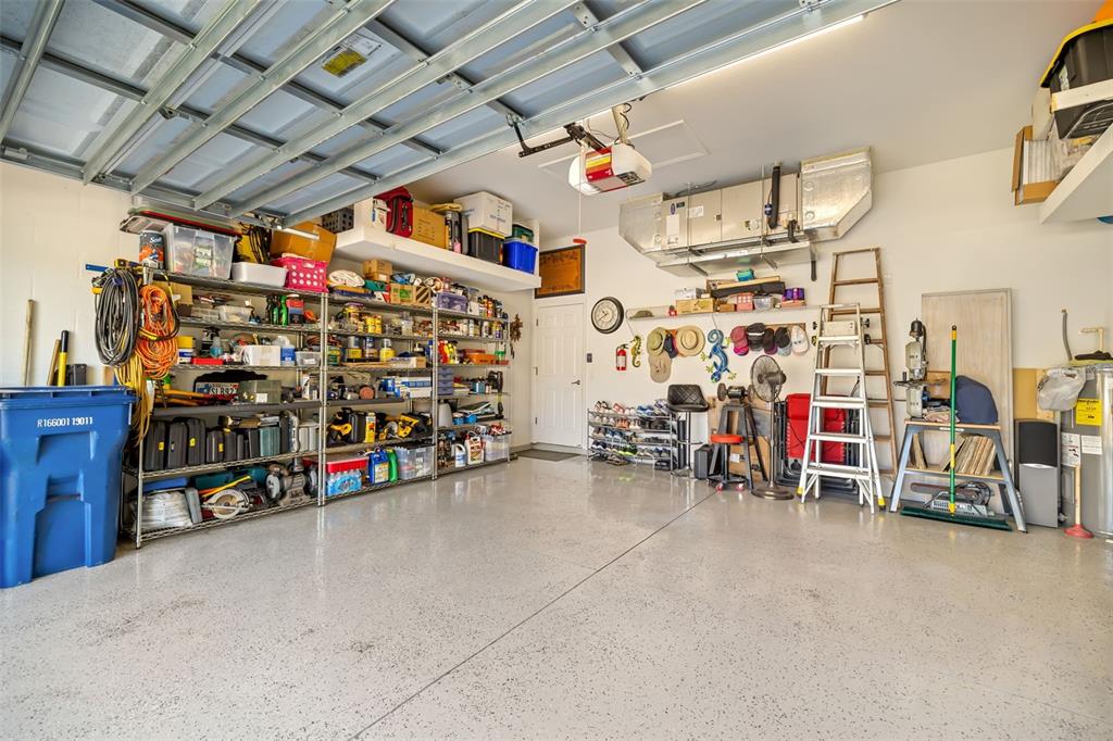 12844 24th St Circle East Parrish, FL 34219 - Photo 33 of 57 a view of a storage room with racks