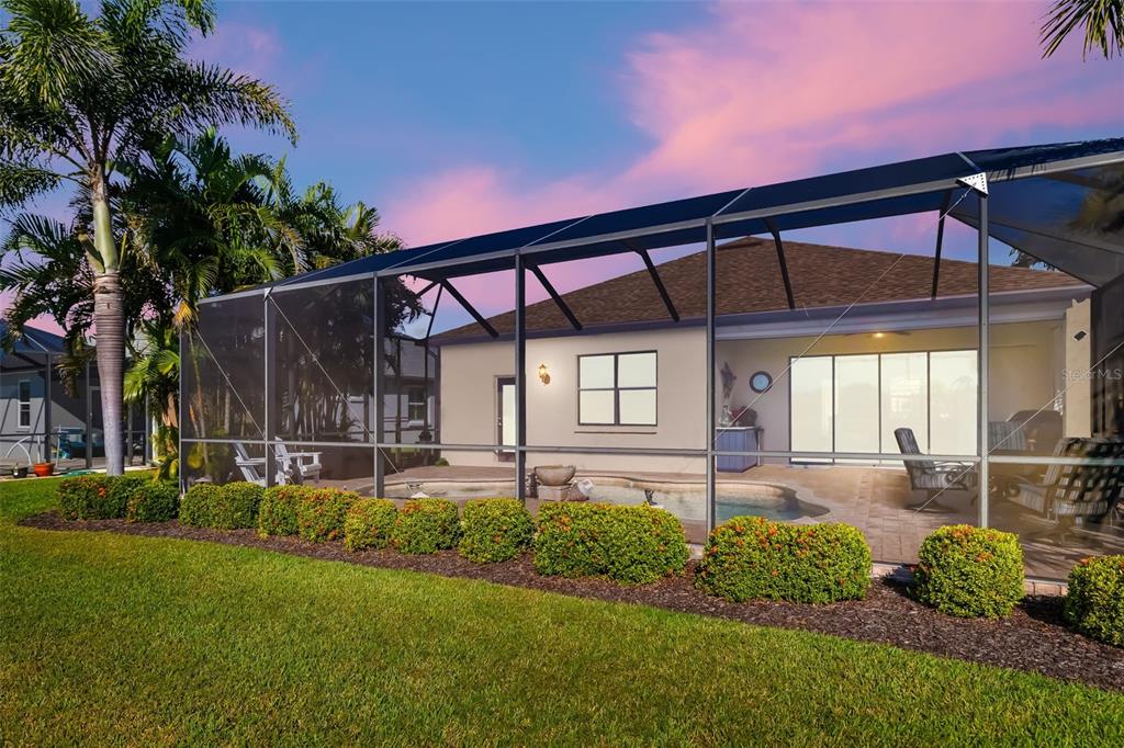 12844 24th St Circle East Parrish, FL 34219 - Photo 36 of 57 a front view of a house with a garden and yard