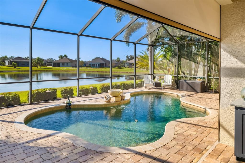 12844 24th St Circle East Parrish, FL 34219 - Photo 37 of 57 a view of a swimming pool with a porch
