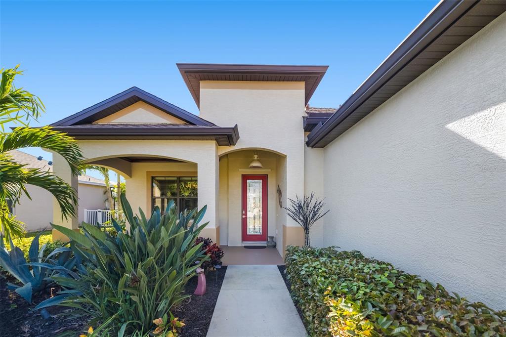 12844 24th St Circle East Parrish, FL 34219 - Photo 4 of 57 a front view of a house with a yard
