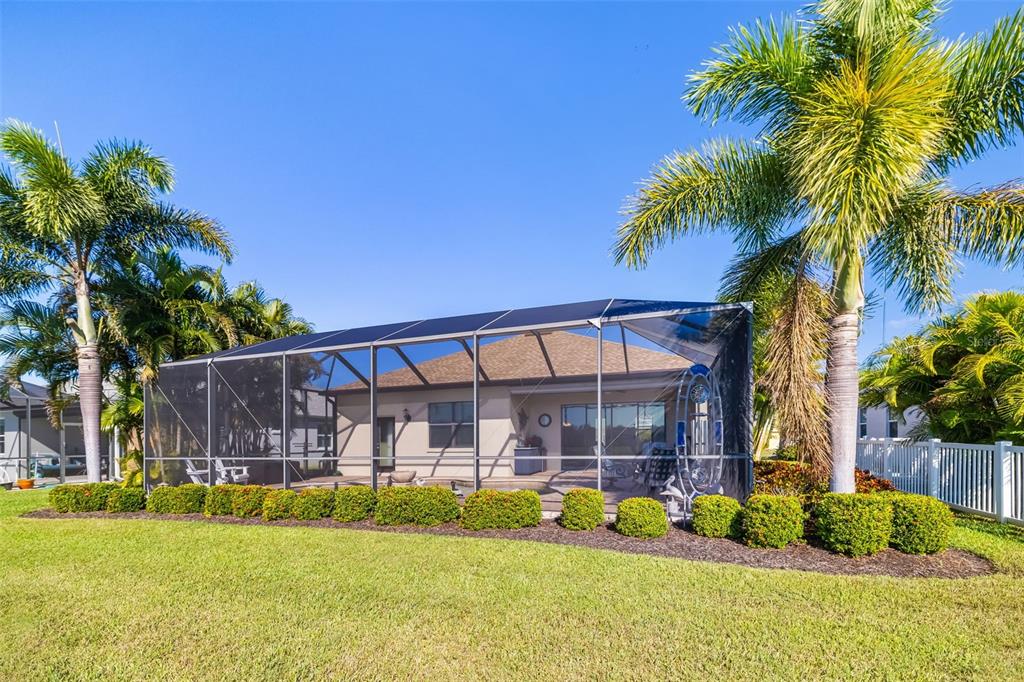 12844 24th St Circle East Parrish, FL 34219 - Photo 42 of 57 a front view of a house with swimming pool having outdoor seating